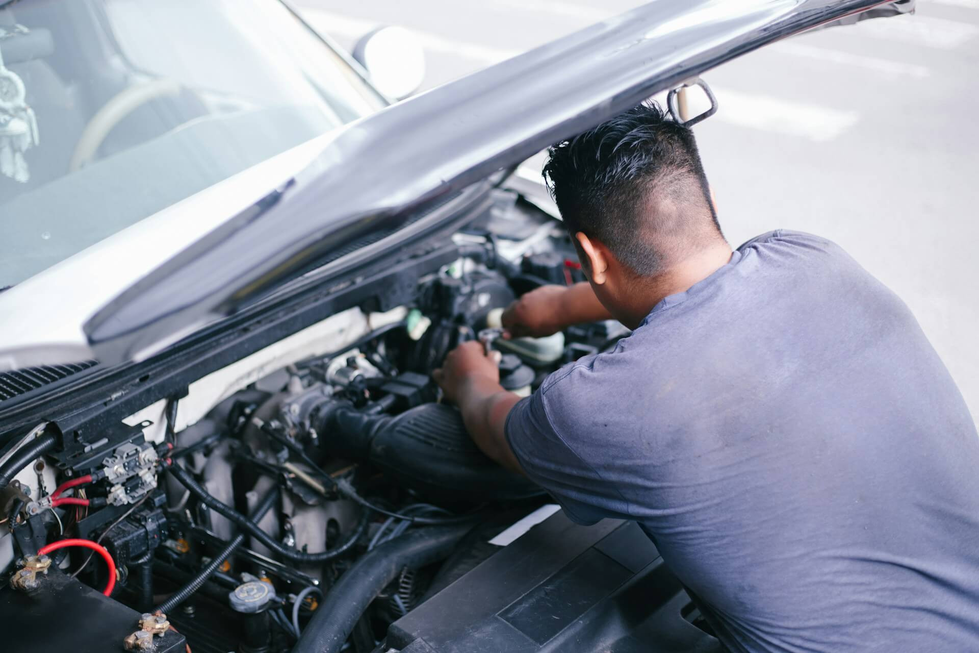 a mechanic clearing a salvage title car